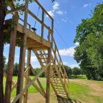 Commercial zip wire installation with elevated timber starting platform
